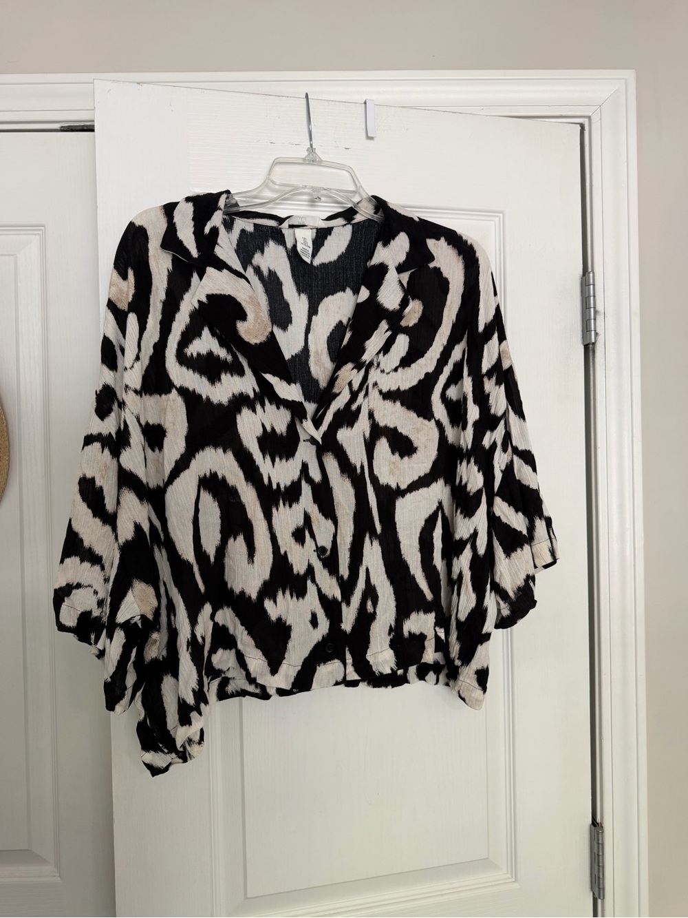 H&M black and white abstract swirl print blouse, size L